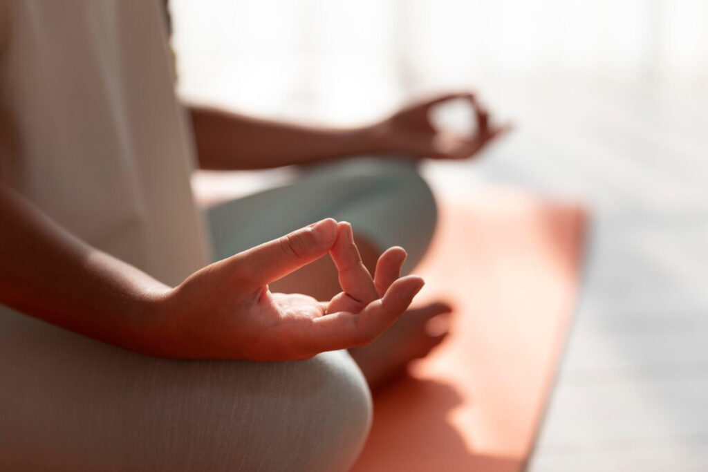 Cancer survivor practising mindfulness meditation for emotional wellness during treatment
