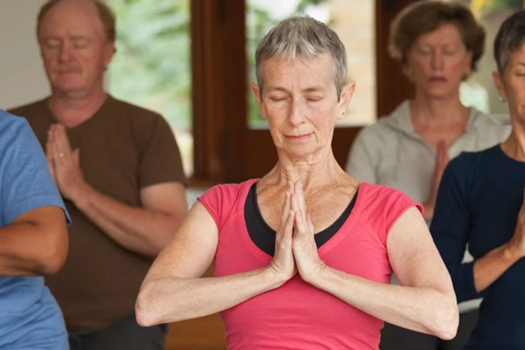 Cancer survivor practising breathing exercises for stress relief and wellness